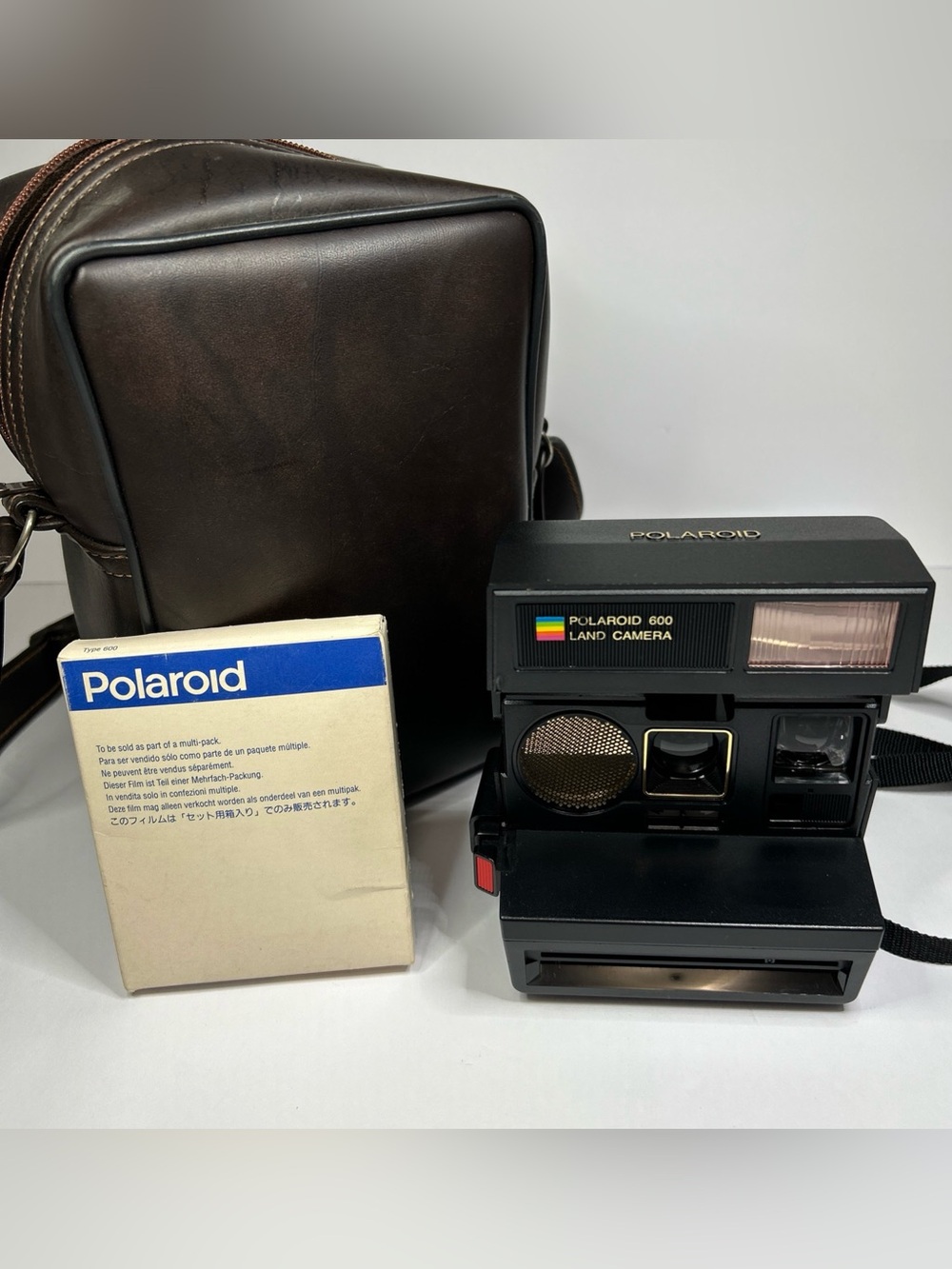 Vintage Polaroid 600 instant camera with case and film